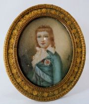 A metal famed and glazed miniature watercolour of a boy in a blue coat. Signed Lucas middle right.