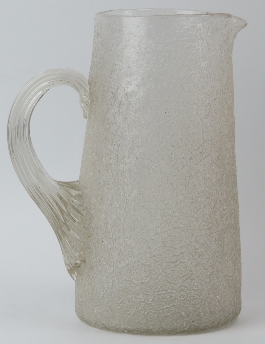 A large cracked ice glass jug, late 19th/early 20th century. Modelled with a reeded loop handle.