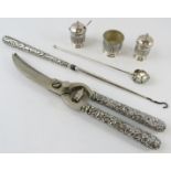 A pair of white metal handled poultry shears, a similar button hook, three piece Eastern cruet and