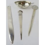 Three white metal paperknives, one marked Peru 925 and a leaf shape dish marked 925. Gross