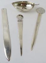 Three white metal paperknives, one marked Peru 925 and a leaf shape dish marked 925. Gross