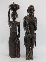 Two large East African carved hardwood male and female figures. 70 cm height, 73 cm height.