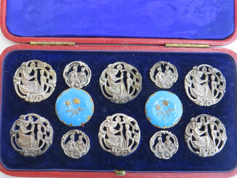 A cased set of late Victorian white metal and enamelled brass buttons. Catchpole and Williams - Image 2 of 3