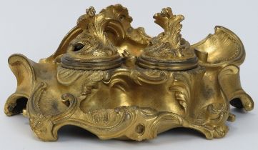 A French Louis XV gilt bronze inkwell, 18th century. Both containers with hinged covers. 18.3 cm