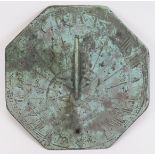 An octagonal bronze sundial, probably 18th/19th century. The octagonal plate with angular S scrolled