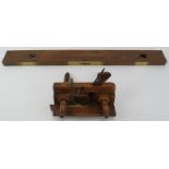 An antique plough plane and Wilson Lovatt & Sons spirit level. Spirit level: 76 cm length. (2