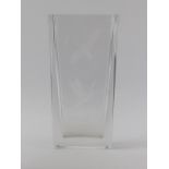 An Orrefors Swedish clear crystal glass vase, 20th century. Engraved with cranes in flight above a