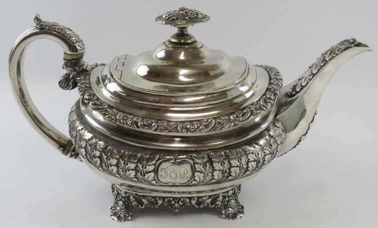 A late George III ornate silver teapot with acanthus and scallop decoration standing on a four - Image 2 of 5