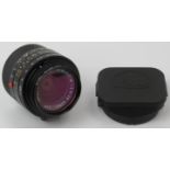 A Leica Elmarit-M 1:2,8 / 28mm ASPH E39 black camera lens. With cap, hood, case, paperwork and