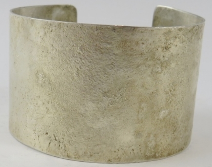 A wide silver Artisanal cuff with textured finish, 4.2cm wide, 6.5cm diameter, feature hallmarks