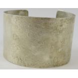 A wide silver Artisanal cuff with textured finish, 4.2cm wide, 6.5cm diameter, feature hallmarks