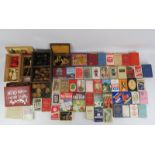 A large vintage collection of gaming cards, chess pieces and other games. (Quantity). Condition