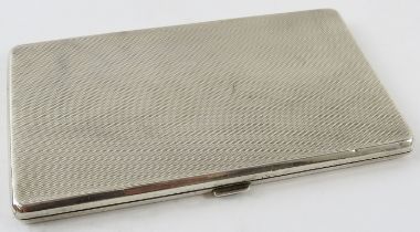 A machine turned silver cigarette case with gilded interior. Hallmarked for Birmingham 1933, maker