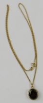 A 9ct yellow gold and garnet pendant with filed curb chain 45cm long, gross total weight 2.2gms