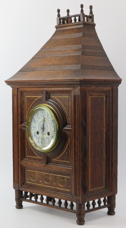 A large carved oak bracket clock, late 19th/early 20th century. With blue and white enamelled - Image 2 of 5