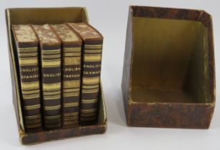 Set of four Midget Series Language Dictionaries, each leather bound and gold blocked, in fitted