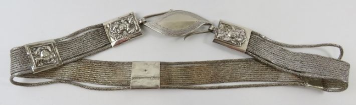 A white metal snake link belt with s-hook clasp, probably South East Asian. Indistinct marks.
