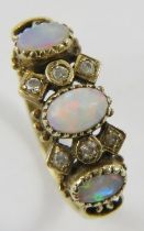 A 9ct yellow gold opal and dimond half-hoop ring, the oval cabochon opals multicoloured red, blue,