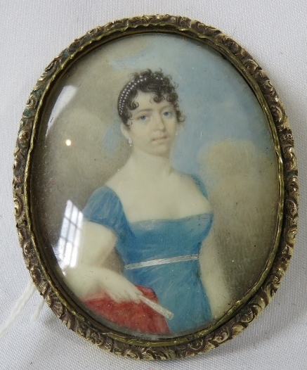 A 19th century miniature on mother of pearl, 'Study of a young lady in blue dress', unsigned. 6cm