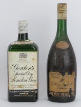 A vintage bottle of Remy Martin & Co cognac and a bottle of Gordon’s Gin. (2 items). Condition