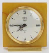 A vintage Jaeger LeCoultre eight day recital alarm travel clock. With an amber coloured bakelite