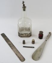 Mixed silver to include a paperknife, thimbles, needle case, shoe horn, perfume bottle and white