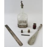 Mixed silver to include a paperknife, thimbles, needle case, shoe horn, perfume bottle and white