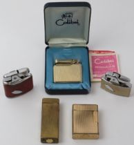 A group of vintage lighters. Makers include Ronson, S.T. Dupont, Dunhill and Colibri. (5 items).