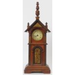 A novelty mahogany clock tower mantle clock, late 19th/early 20th century. Key included. 36.7 cm