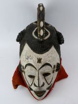 Tribal Art: An African Igbo carved and painted wood mask, Nigeria. 43 cm height. Condition report: