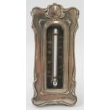 An early 20th century silver mounted Art Nouveau desk thermometer on easel stand. Hallmarked for