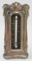 An early 20th century silver mounted Art Nouveau desk thermometer on easel stand. Hallmarked for