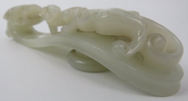 A Chinese celadon jade dragon belt hook, 18th/19th century. Finely carved depicting a chilong dragon - Image 5 of 8