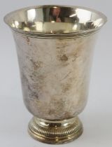 A French silver beaker with flared rim and gadrooned foot. 8th century style marks to base and later