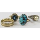 A 9ct yellow gold ring set with a turquoise bead; a blue topaz and diamond cluster ring; a pearl