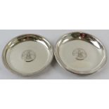 Two German silver dishes with inset three Mark coins and beaded rims. Largest 12.5cm diameter.