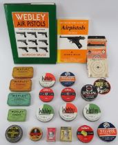 A collection of air pistol books, pellet boxes and targets. Books included The Collector’s Guide