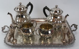 A Rogers Brothers plated silver four piece tea set with serving tray and two pepper pots. (7