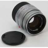 A Leica Summicron-M 1:2 50mm E39 silver camera lens. Leica caps, case and box and included. Serial