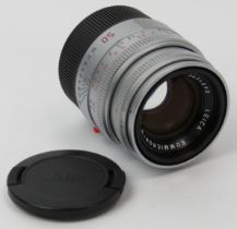 A Leica Summicron-M 1:2 50mm E39 silver camera lens. Leica caps, case and box and included. Serial