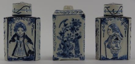 Three Dutch Delft tea caddies, 18th/19th century. Comprising a pair of tea caddies with covers