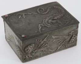 A rare Arts & Crafts pewter trinket box, early 20th century. Decorated in repoussé with a dragon and