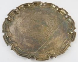 A Georgian style silver tray with pie crust rim and engraved centre. Hallmarked for Birmingham 1961,