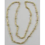 A 9ct yellow gold fancy link neckchain with alternating ribbed bead and open twisted links,