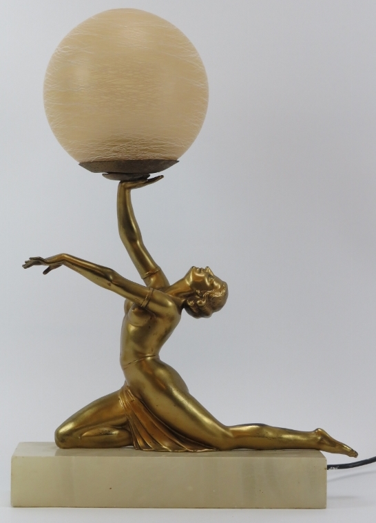 A vintage Art Deco gilt spelter figural table lamp. Modelled as a female dancer holding a