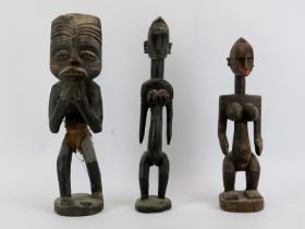 Three African carved wood figures. (3 items) 50 cm tallest height. Condition report: Light age