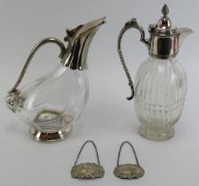 Two glass decanter with silver plated mounts and two silver Whisky and Brandy labels. Comprising a