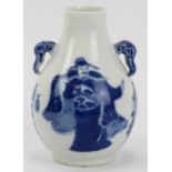 A Chinese blue and white porcelain vase, 19th century. Of pear shaped form with elephant’s head twin