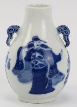 A Chinese blue and white porcelain vase, 19th century. Of pear shaped form with elephant’s head twin