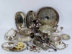 A large group of silver plated wares. Notable items included serving trays, an entree dish, a jug,